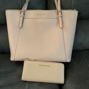 Pale pink Michael Kors satchel and pink wallet
